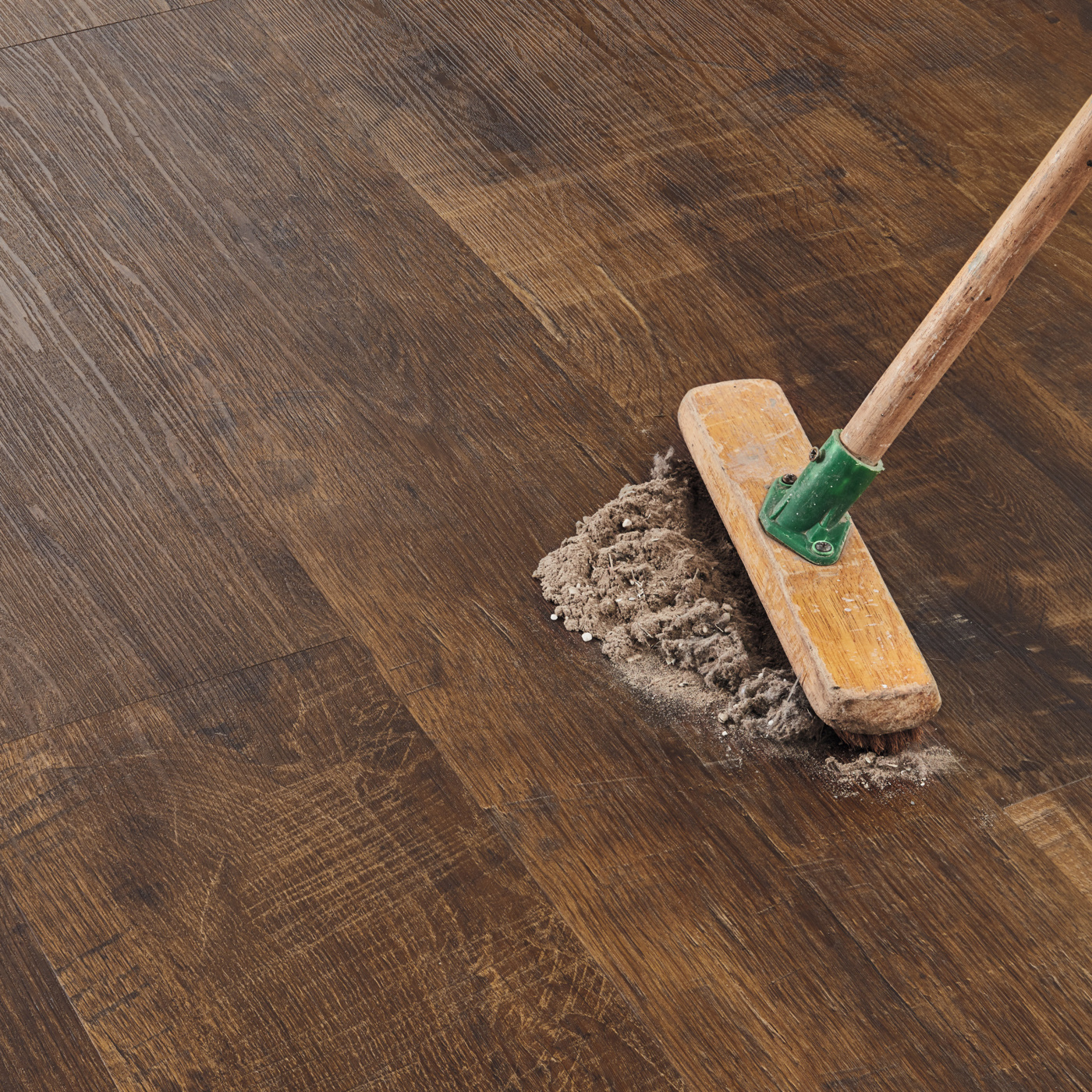 Broom sweeping up dust on Antique French Oak RKP8110 floors