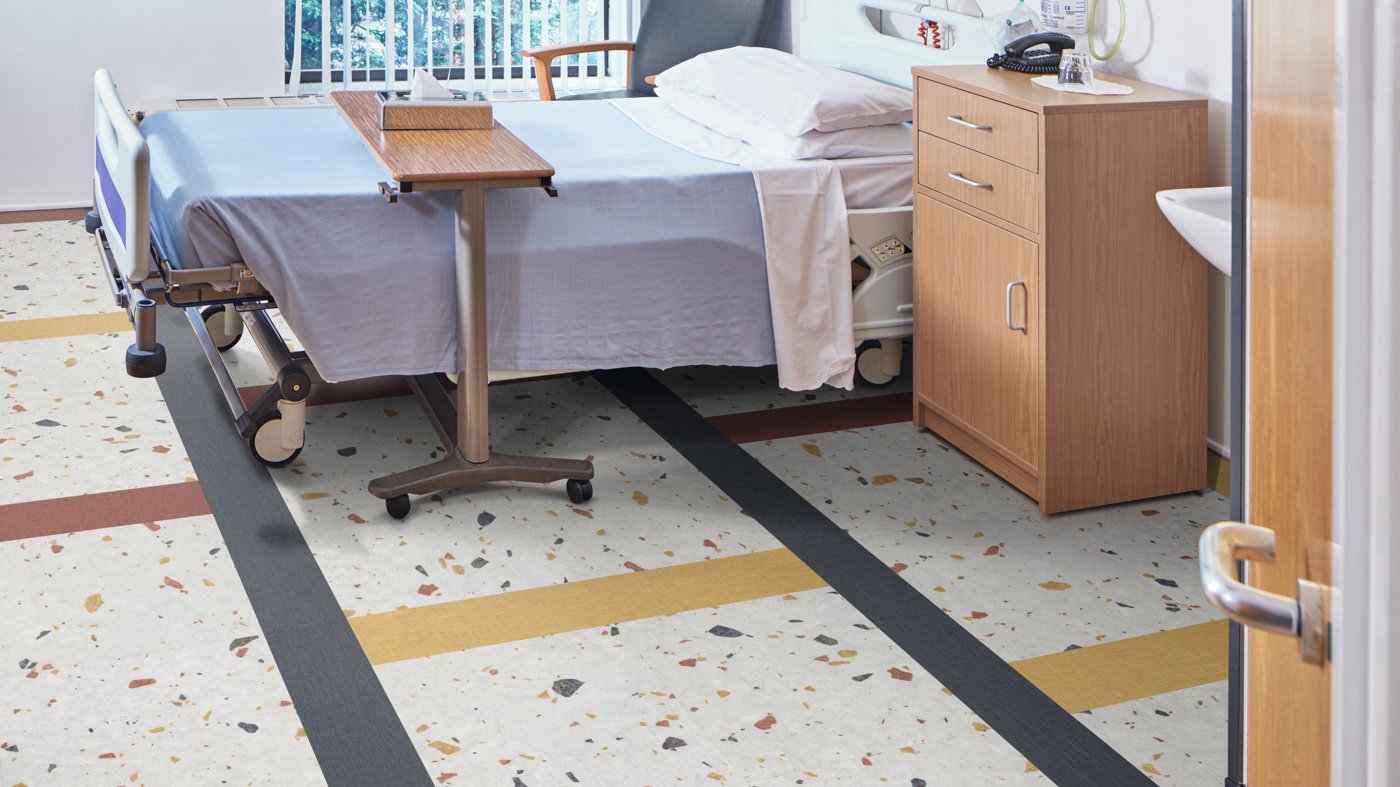 Patient room where Salute Grisio SP118, Burnt Sienna SP719, Yellow Ochre SP726 and Indigo SP720 floors create a modern look