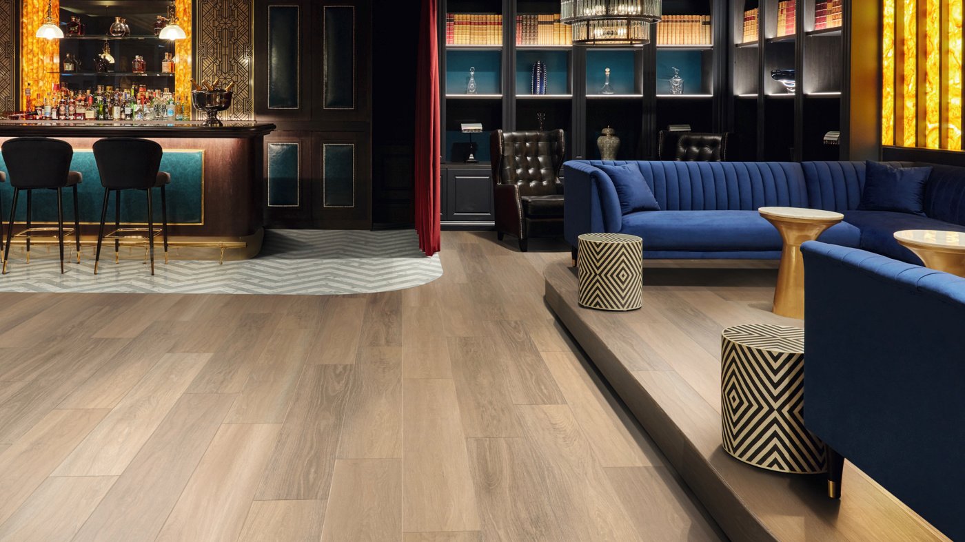 Dune Oak RL24 floors with custom cut Calacatta d'Oro LM33 and Pavimento Bianco LM42 herringbone floors to zone the bar area