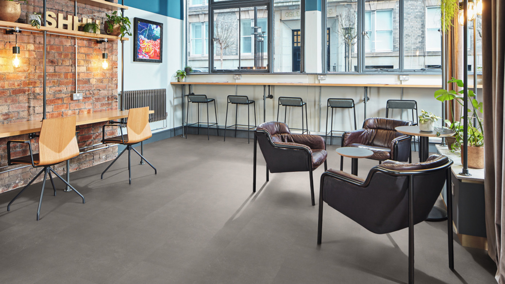 Karndean Commercial Urban Grey rigid core LVT stone flooring in a co-working space