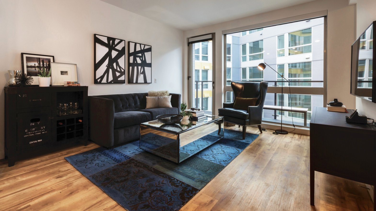 Pike Motorworks apartment living room featuring Karndean LVT floors