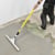 Installer spreading a generic floor leveler