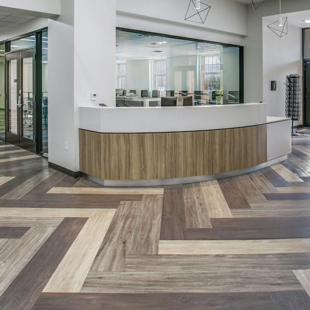 Lobby with Raven Oak LLP302, Pearl Oak LLP306 and French Grey Oak LLP308 in a herringbone pattern