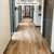 Weathered Elm WP511 floors in a hallway designed by Paint It Black Interiors